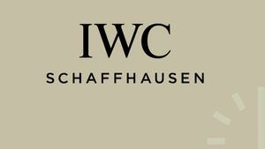 iwc-logo-vor-braunem-hintergrund-mit-minuten-in-der-unteren-rechten-ecke