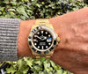 gebrauchte Rolex Submariner Gold am Arm