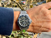 Rolex Submariner 1680 mit Papieren am Handgelenk eines Mannes